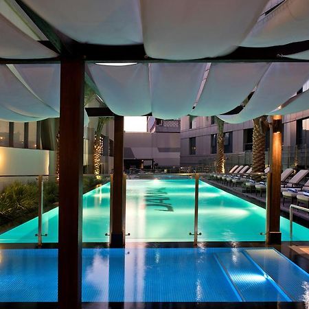 Damac Maison The Vogue Dubaj Zewnętrze zdjęcie The pool at the hotel
